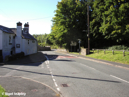 Photo of a road with a pub on the left-hand side