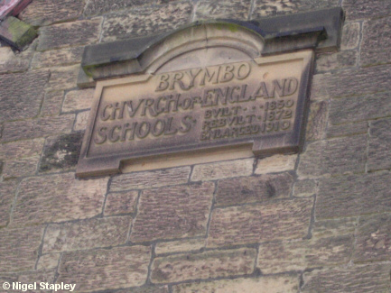 Picture of plaque in the gable of an old school building