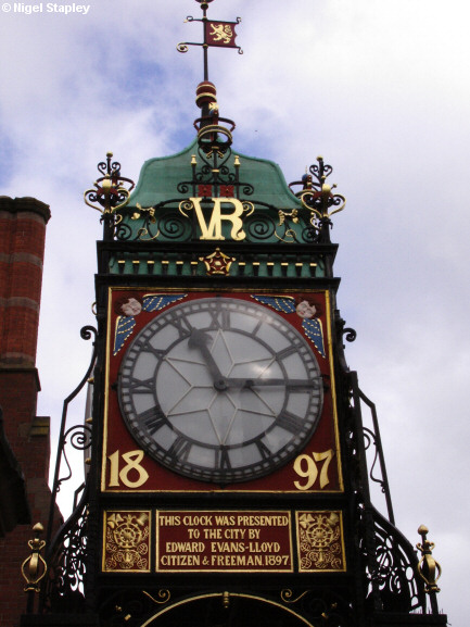Picture of an ornate clock on a city wall
