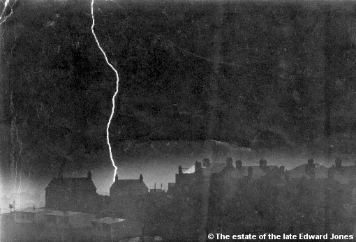 Picture of lightning striking a village at night