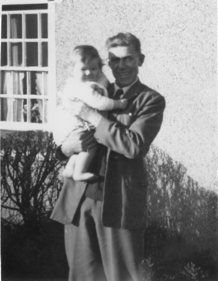 Picture of baby in a man's arms