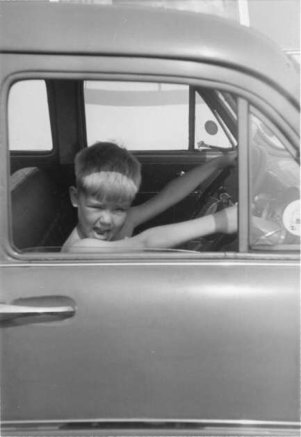 Picture of small boy in the front seat of a car