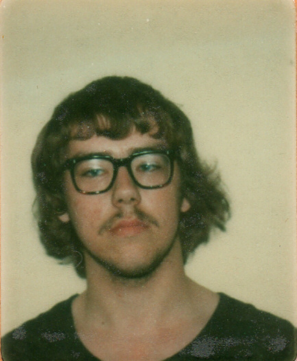 Passport-style photo of a young man