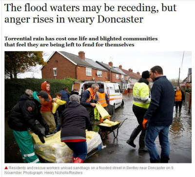 Photo of people clearing up after floods in Doncaster