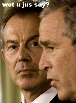 Picture of Blair looking at Bush. Caption: 'Wot u jus say?'