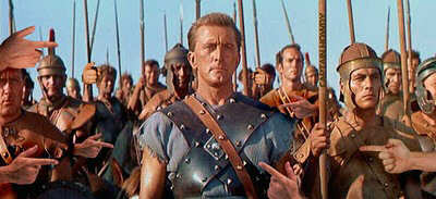 Picture of Charlton Heston as Spartacus, with everyone pointing at him