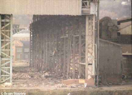 Photo of a partly-destroyed industrial building