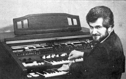 A black and white photo of Alan Haven at the organ