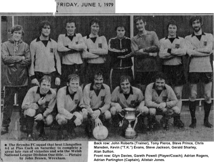 Photograph of a football team with a trophy