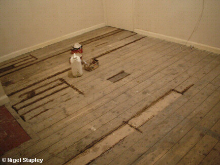 Photo of dirty floorboards