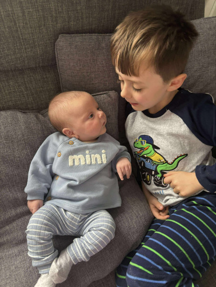 Photo of a baby and a young boy