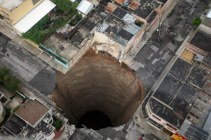 Photo of a huge sinkhole in the middle of Guatemala City