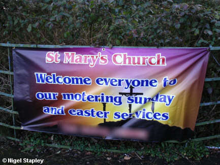 Photo of a banner advertising a church's services for 'Motering Sunday'