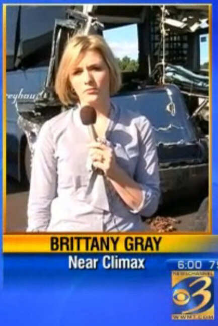 Screenshot of a very serious-looking woman news reporter with the caption 'Near Climax'