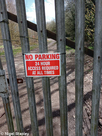 Photo of sign saying 'No Parking: 24 Hour Access Required At All Times'