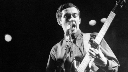 Photo of Pete Shelley on stage