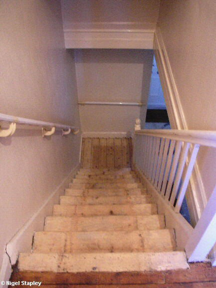 Photo looking down some sanded stairs