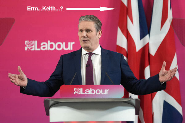 Keir Starmer claiming Labour isn't a nationalist party while standing in front of two enormous Union Jacks