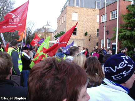 Photo of flags at a protest rally